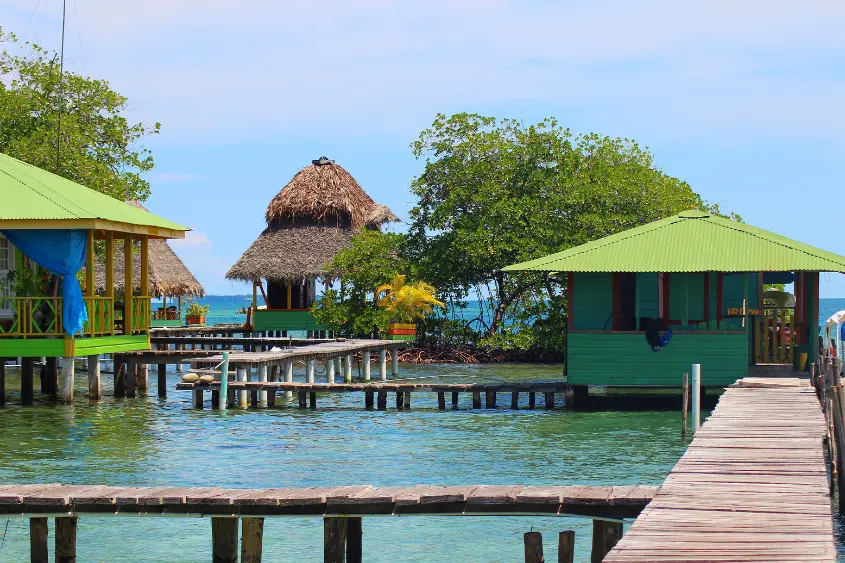 Colorful wooden houses over turquoise water at Bocas del Toro Panama