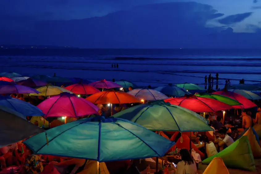 Romantic beachfront villa in Seminyak Bali with infinity pool at sunset