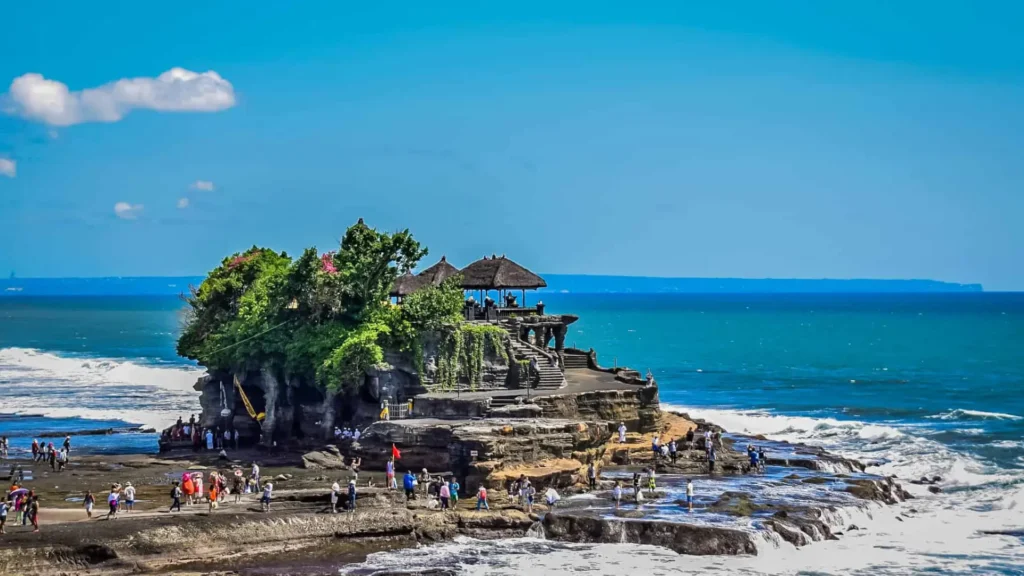 Aerial view of Bali island coastline with tropical beaches, lush jungle and calm ocean representing a travel itinerary overview
