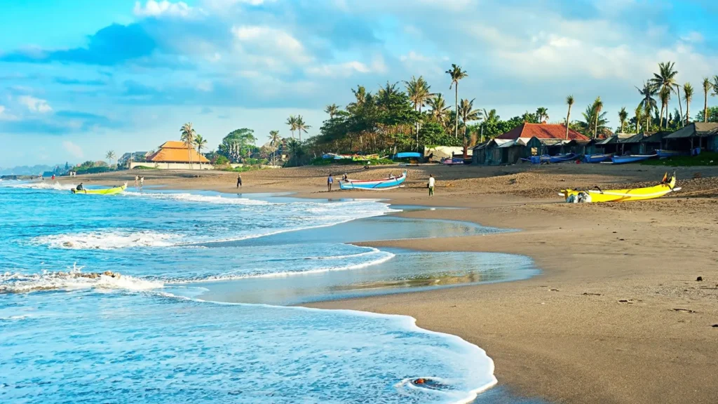 Canggu Bali beach with surf waves, palm trees and sunset atmosphere showing relaxed coastal lifestyle and cafes